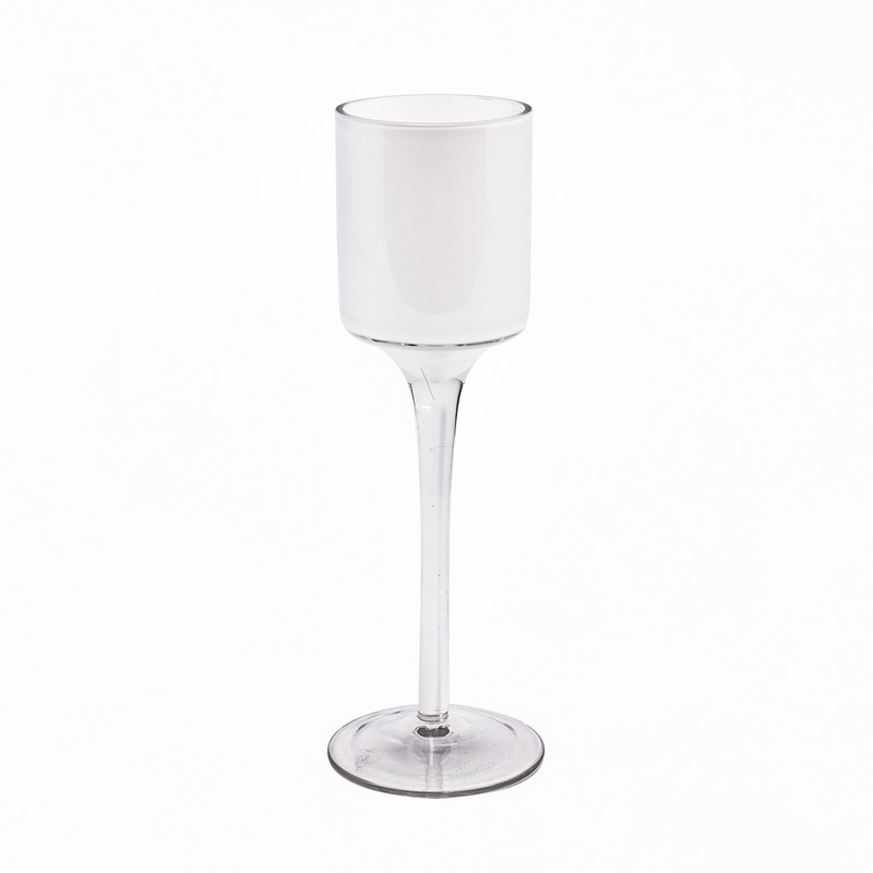 An elegant 7.5 inch tall stemmed glass candle holder with frosted white cup
